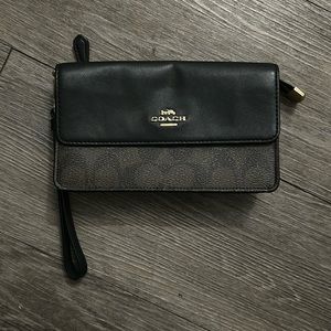 Coach Wristlet with back zipper pocket, 2 card slots.